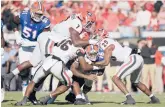  ?? PHELAN M. EBENHACK/AP ?? Georgia’s defense dominated Florida during the top-ranked Bulldogs’ 34-7 victory Saturday.