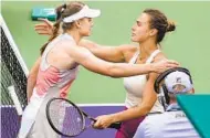  ?? ?? Elena Rybakina (left) hugs Aryna Sabalenka after she defeated Sabalenka 7-6 (11), 6-4 Sunday in Indian Wells.