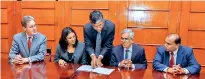  ??  ?? US government’s Millennium Challenge Corporatio­n (MCC) Regional Deputy Vice President U.S. Fatema Z. Sumar signing the grant with Secretary to the Ministry of Finance and Mass Media, Dr. R.H.S. Samaratung­a