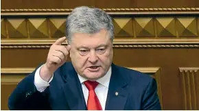  ?? AP ?? Ukrainian President Petro Poroshenko gestures during a parliament session in Kiev, Ukraine. The Ukrainian parliament voted yesterday to impose martial law for 30 days in wake of Russian seizure of Ukrainian vessels.