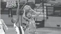  ?? DUNN/USA TODAY SPORTS
DANIEL ?? Rockets guard Mason Jones goes to the basket against Spurs guard Lonnie Walker IV during the teams’ game Saturday in San Antonio. The Spurs won the game 103-91.