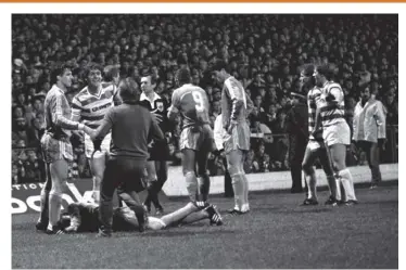  ??  ?? 0 A Rapid Vienna player lies injured after the bottle-throwing incident at Parkhead in 1984