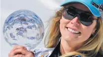  ??  ?? GETTY IMAGES American Mikaela Shiffrin poses for a photo with her fourth World Cup globe at the FIS Alpine Ski World Cup in Soldeu, Andorra, on March 17, 2019.