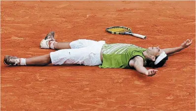  ?? CHRISTOPHE ENA THE ASSOCIATED PRESS FILE PHOTO ?? Rafael Nadal reacts after winning the 2005 French Open. Nadal has a career record of 112-3 at Roland Garros, but will miss this year’s tournament with a hip injury.