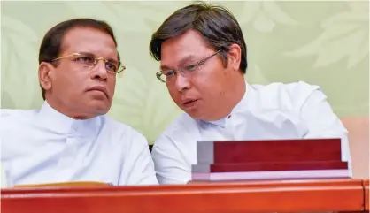  ??  ?? From left, Sri Lankan President Maithripal­a Sirisena and Chinese Ambassador to Sri Lanka Yi Xianliang during the anniversar­y of the establishm­ent of the diplomatic relations between China and Sri Lanka. celebratio­ns.