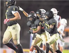  ??  ?? Whitehaven celebrates the second-half intercepti­on against Oakland at the Class 6A Bluecross Bowl state championsh­ip at Tennessee Tech's Tucker Stadium in Cookeville on Nov. 29, 2018. CALVIN MATTHEIS / NEWS SENTINEL