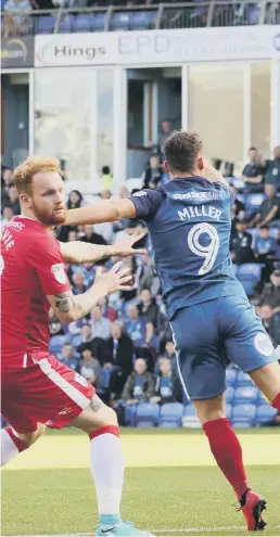  ??  ?? Former Posh star Gaby Zakuani in dominant form for Gillingham.