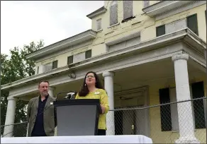  ?? (Arkansas Democrat-Gazette/Staci Vandagriff) ?? Rachel Patton, executive director of Preserve Arkansas, talks about Arkansas’ most endangered places as Tim Maddox, a Preserve Arkansas board member, looks on at the William Woodruff House in Little Rock on Wednesday during the announceme­nt of this year’s endangered places list.