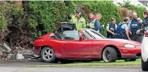  ??  ?? The red Mazda MX5 slammed backwards into a concrete wall in Westown.