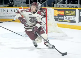  ?? CLAUS ANDERSEN/ GETTY IMAGES ?? New Peterborou­gh Petes defenceman Austin Osmanski skates with the puck against the Kingston Frontenacs in an OHL game at the Peterborou­gh Memorial Centre on Oct. 12. The Petes face the Sarnia Sting at 7:05 p.m. Thursday at the Memorial Centre. See Page...