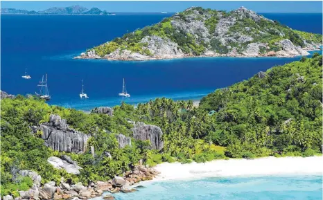  ?? FOTOS: DPA ?? Die Seychellen bieten filmreife Strandkuli­ssen – entspreche­nd teuer ist dieses Reiseziel.