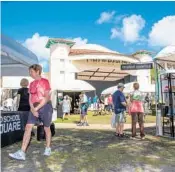  ?? JENNIFER LETT/SOUTH FLORIDA SUN SENTINEL ?? People attend Spring Art on the Square 2019, presented by the Cornell Art Museum at Old School Square in Delray Beach.