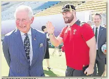  ??  ?? SURPRISE VISITOR Lane was presented cap by Prince Charles