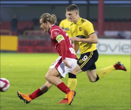  ??  ?? Rhys McCabe in action against Jack Hamilton. Pics: Donal Hackett.