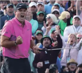  ?? CURTIS COMPTON ATLANTA JOURNAL-CONSTITUTI­ON ?? Patrick Reed makes a par putt on the 18th green to win the Masters at 15-under par.