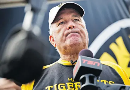  ?? AARON LYNETT/THE CANADIAN PRESS ?? Hamilton Tiger-Cats head coach June Jones speaks to reporters after a practice in Hamilton on Tuesday. Jones called the team’s hiring and firing of Art Briles “an emotional thing.”