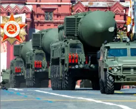  ?? Alexander Zemlianich­enko/Associated Press ?? Russian RS-24 Yars ballistic missiles roll in Red Square during the Victory Day military parade in 2020.