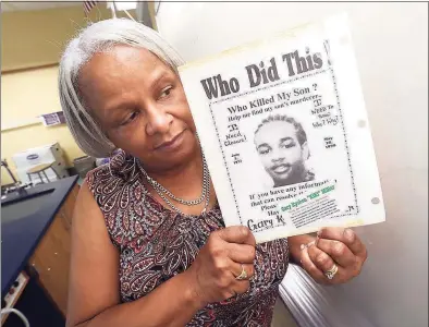  ?? Arnold Gold / Hearst Connecticu­t Media ?? Marlene Pratt holds a poster requesting informatio­n about the killing of her son, Gary Kyshon “Kiki” Miller, who was killed on May 20, 1998.