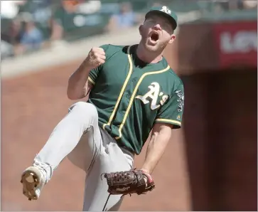  ?? AP PHOTO BY JEFF CHIU ?? Oakland Athletics pitcher Liam Hendriks celebrates after striking out San Francisco Giants’ Brandon Belt for the final out of a baseball game in San Francisco, Wednesday, Aug. 14, 2019. The A’s won 9-5.