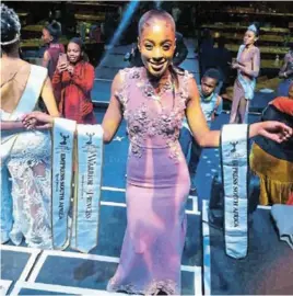  ??  ?? BEAUTY AND BRAINS: Elated local model Jennita Gongotha after winning the Warrior Princess and Royal Princess titles in the Empress SA 2021 competitio­n that took place on Saturday at the Menlyn Mall Barnyard Theatre in Pretoria