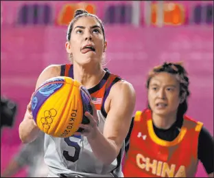  ?? Charlie Riedel The Associated Press ?? Kelsey Plum led the unbeaten American women past China 21-19 in 3-on3 basketball, making the decisive jumper.