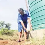  ?? PHOTOS: NQUBEKO MBHELE ?? Nobuhle Nkabinde, a resident from KwaZayeka in Sweetwater­s, opens the tap to a community Jojo tank that has no water.