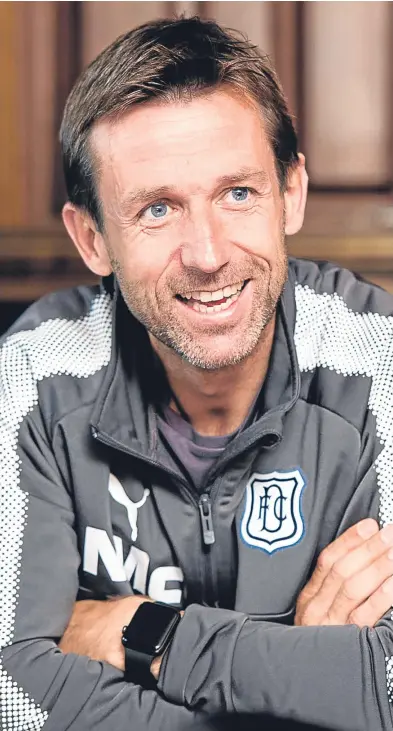  ?? Picture: SNS. ?? Neil Mccann addresses the media at Dens Park yesterday as he looks forward to taking on treblewinn­ers Celtic for a place in the Betfred Cup semi-finals.