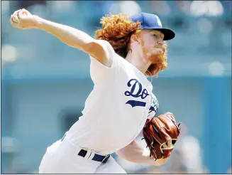  ??  ?? Los Angeles Dodgers starting pitcher Dustin May throws to a St Louis Cardinals batter during the first inning of a
baseball game in Los Angeles on Aug 7. (AP)