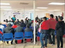  ?? Molly Hennessy-Fiske Los Angeles Times ?? MIGRANTS GATHER at a McAllen, Texas, shelter. In Texas’ Rio Grande Valley, many families from Central America arrive daily with small children.