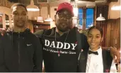  ?? FAMILY ?? Eric Satterwhit­e, center, died Saturday after a shooting and rollover crash on I-94 near South Holland. Satterwhit­e, with son Storm and daughter Nakia, is remembered as a family man and life of the party.