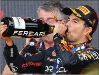  ?? ?? Thirsty work: Sergio Perez after winning in Azerbaijan — now the Mexican has to prove he is not just a specialist on street circuits