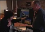  ?? RICHARD PAYERCHIN — THE MORNING JOURNAL ?? Lorain City Council Ward 1 Candidate Beth Henley talks to Rob Levit of Lorain Rotary about the Sunset Pier proposed for the west end of the beach at Lakeview Park in Lorain.