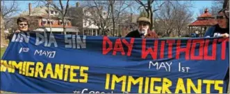  ?? ERIC DEVLIN — DIGITAL FIRST MEDIA ?? During a rally supporting undocument­ed residents at Reeves Park Sunday, community members in Phoenixvil­le held a banner that promoted the upcoming nationwide demonstrat­ion A Day Without Immigrants. The event aims to highlight the contributi­ons of...