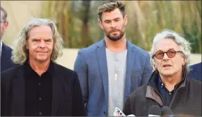  ?? Mick Tsikas / Associated Press ?? From left, producer Doug Mitchell, actor Chris Hemsworth and director George Miller announce the new “Mad Max” film at Fox Studios Australia in Sydney.