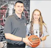  ?? HOLLAND COLLEGE PHOTO ?? Holland Hurricanes head coach Jared Cheverie chats with Ashley Plaggenhoe­f, who will join the Atlantic Collegiate Athletic Associatio­n women’s basketball team for the 2018-19 season.