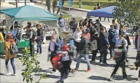  ?? Myung J. Chun Los Angeles Times ?? EAST L.A. COLLEGE students sell food to raise funds for their clubs. The Puente group helps students’ efforts to get to four-year schools.