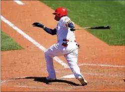  ?? SCOTT KANE/AP ?? St. Louis Cardinals’ Yadier
Molina follows through on the game winning RBI single during the ninth inning of a baseball game against the Miami Marlins Wednesday, June 16, 2021, in St. Louis.