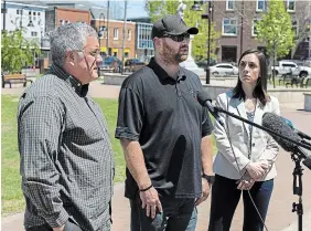  ?? ANDREW VAUGHAN THE CANADIAN PRESS ?? Family lawyers Rob Pineo, left, and Sandra McCulloch flank Nick Beaton, who lost his pregnant wife Kristen in the murder rampage, as they talk with reporters in Truro, N.S. on Wednesday.