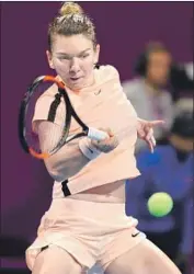  ?? Photograph­s by Karim Jaafar AFP/Getty Images ?? DENMARK’S CAROLINE WOZNIACKI, left, was the first Dane to win a Grand Slam and has traded the No. 1 world ranking this year with Romania’s Simona Halep, right, who held it to start 2018.