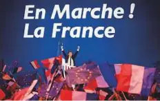  ??  ?? A victorious Emmanuel Macron responds to his enthusiast­ic supporters in Paris on Sunday after the first round of the presidenti­al election.