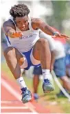  ?? STAFF PHOTO BY ROBIN RUDD ?? McCallie’s Aaron Bastian competes in the triple jump Friday in the Spring Fling Division II-AA track and field championsh­ips at MTSU’s Dean Hayes Track Stadium in Murfreesbo­ro.