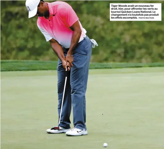  ?? PHOTO REUTERS ?? Tiger Woods avait un nouveau fer droit, hier, pour affronter les verts au tournoi Quicken Loans National. Le changement n’a toutefois pas produit les effets escomptés.