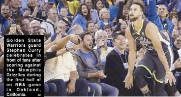  ?? AP ?? Golden State Warriors guard Stephen Curry celebrates in front of fans after scoring against the Memphis Grizzlies during the first half of an NBA game in Oakland, California.