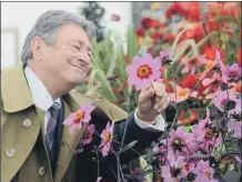  ?? PICTURES: TONY JOHNSON/ SCOTT MERRYLEES/ ADOBE STOCK ?? SHOOTS IN THE SNOW: Left, RHS Garden Harlow Carr curator Paul Cook with early flowering artichokes; above, Alan Titchmarsh at the 2017 RHS Chatsworth Flower Show; below, garlic bulbs.