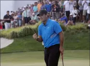 ?? MARK LENNIHAN — THE ASSOCIATED PRESS ?? Patrick Reed pumps his fist on the 18th hole as he wins on The Northern Trust on Aug. 11 in Jersey City, N.J.