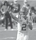  ?? KIM KLEMENT/USA TODAY SPORTS ?? Mississipp­i Rebels quarterbac­k Matt Corral throws the ball against the Indiana Hoosiers during the first half at Raymond James Stadium.