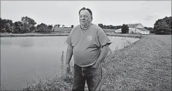  ?? [TOM DODGE/DISPATCH] ?? Don Maloney has three ponds full of freshwater prawns on his property in Fairfield County. He is one of a few farmers in Ohio raising seafood for sale.