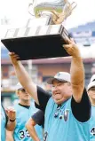 ?? MORNING CALL FILE PHOTO ?? Lehigh Valley manager Ted Plessl raises the Carpenter Cup trophy at Citizens Bank Park after his team won the title in 2011.