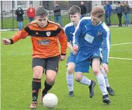  ??  ?? Forfar West End U/19s players (blue) chase down the ball in the game against Dundee United SC.