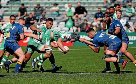  ?? PHOTOS: GETTY IMAGES ?? Manawatu¯ Turbos No 8 Brayden Iose takes on the Otago defence during Sunday’s clash.
